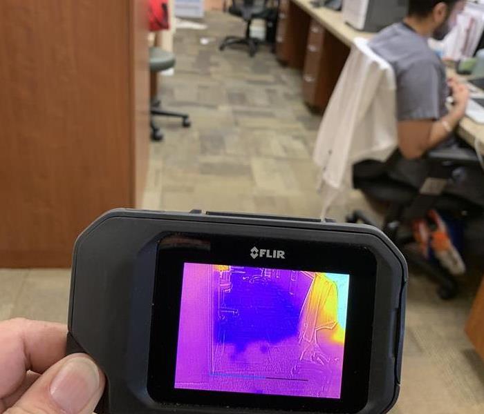 Thermal Imaging displaying standing water underneath the carpet. 