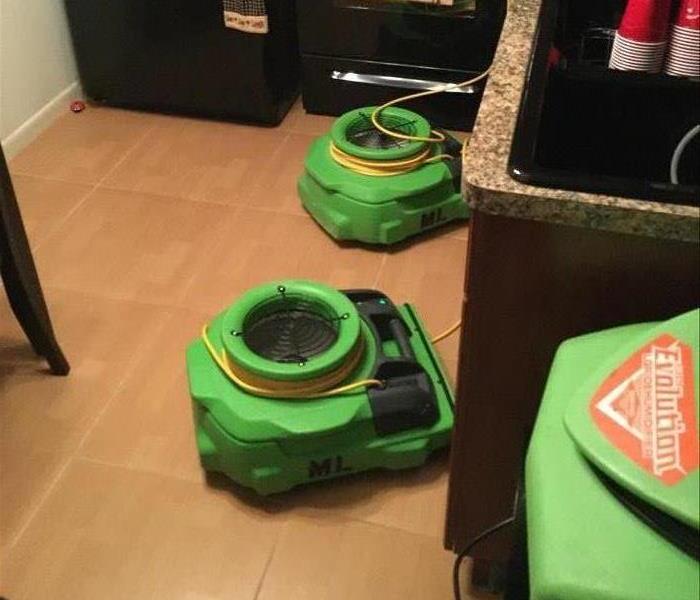 Tile floor with green air movers. 