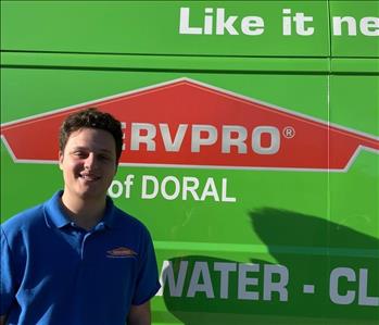 Men standing in front of servpro van
