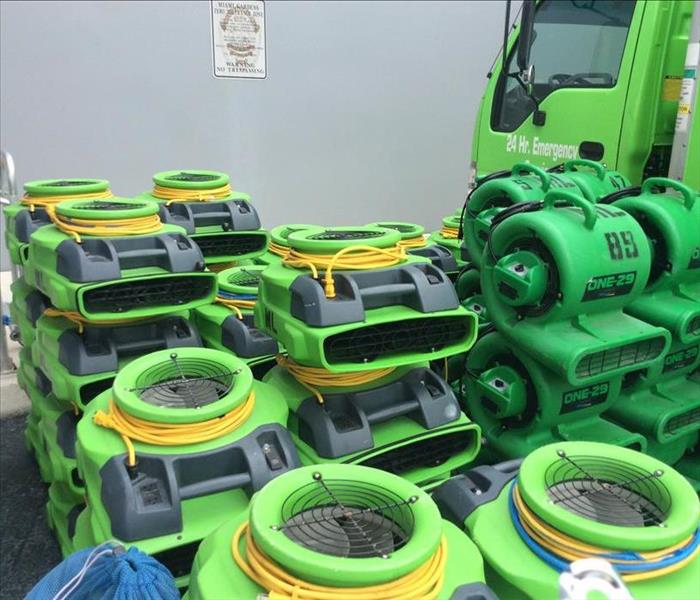Pile of green air movers. 